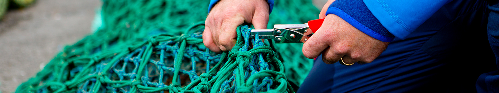 fishing nets being measured by fisheries officer