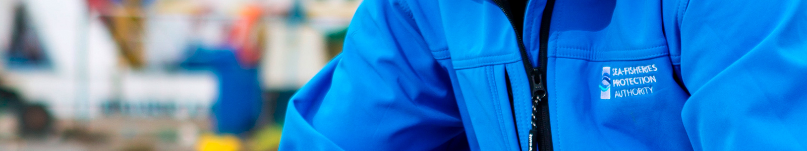 fisheries officer wearing blue jacket